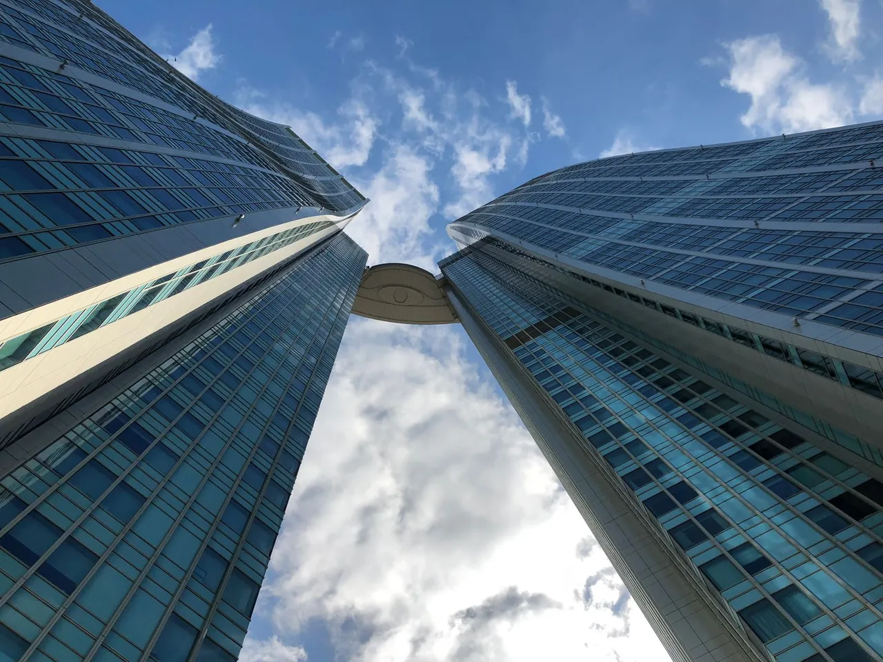 Majestic view of modern skyscrapers reaching towards the sky, emphasizing architectural elegance.