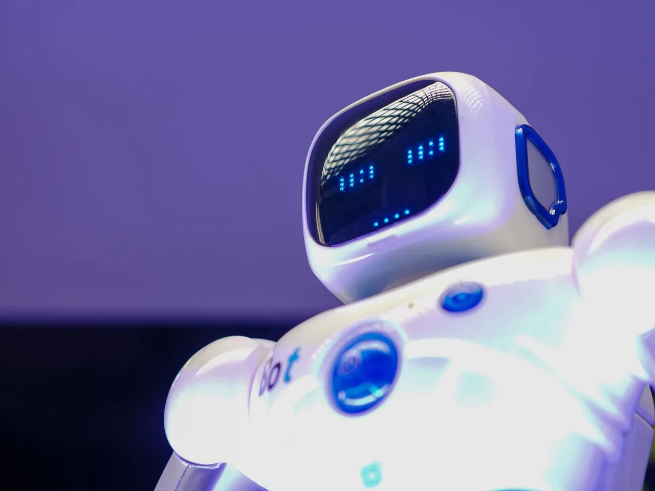Humanoid robot with a digital face display, representing artificial intelligence.